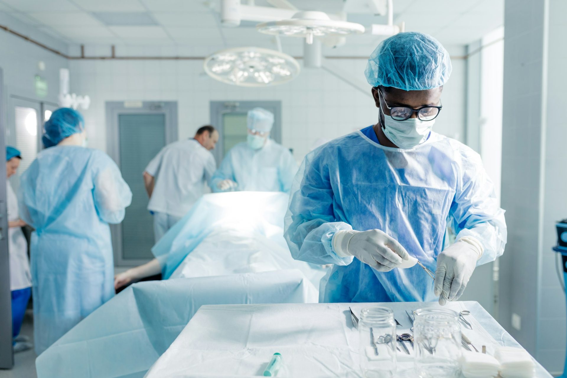 african-male-assistant-preparing-medical-tools