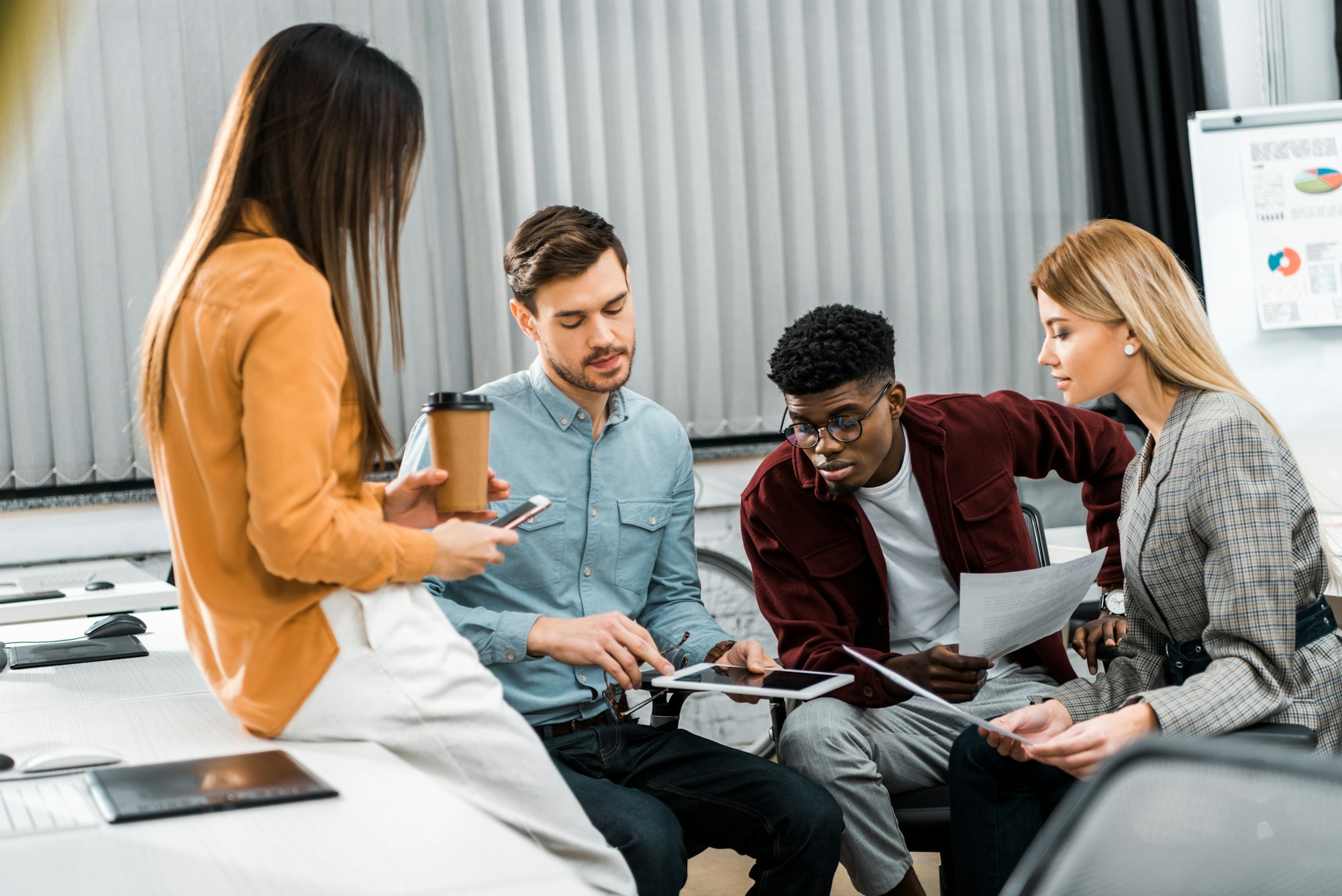 young-businesspeople-discussing-new-business-idea-in-office