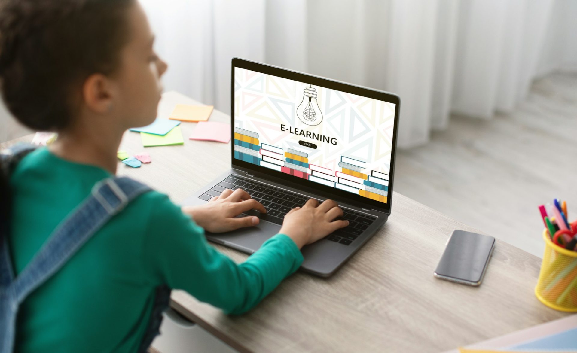 teen-schoolgirl-using-laptop-computer-at-home-for-online-education