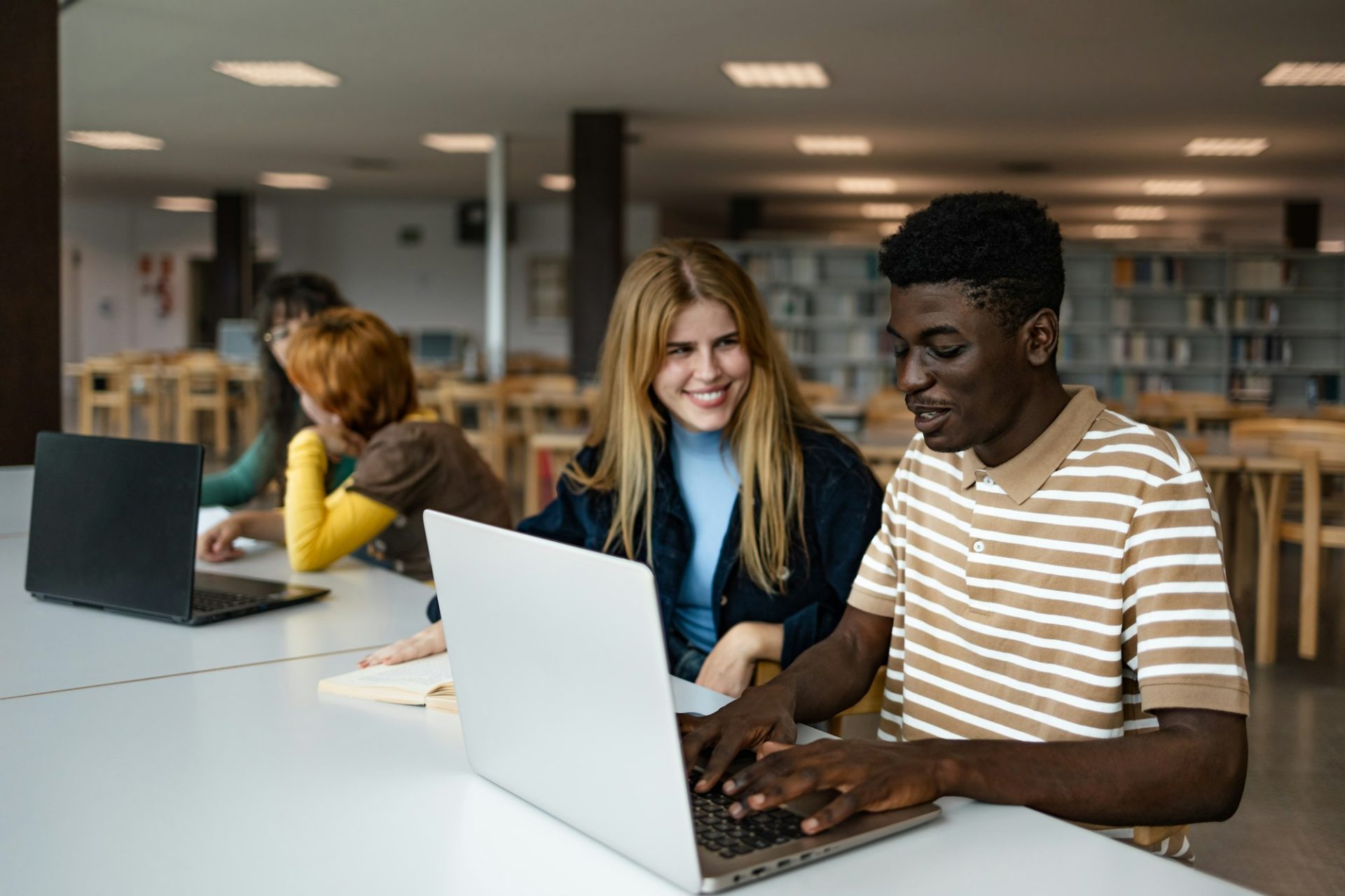 young-people-studying-together-in-university-library